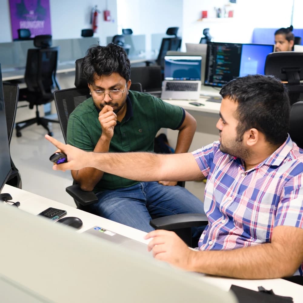 Employees discussing with each other